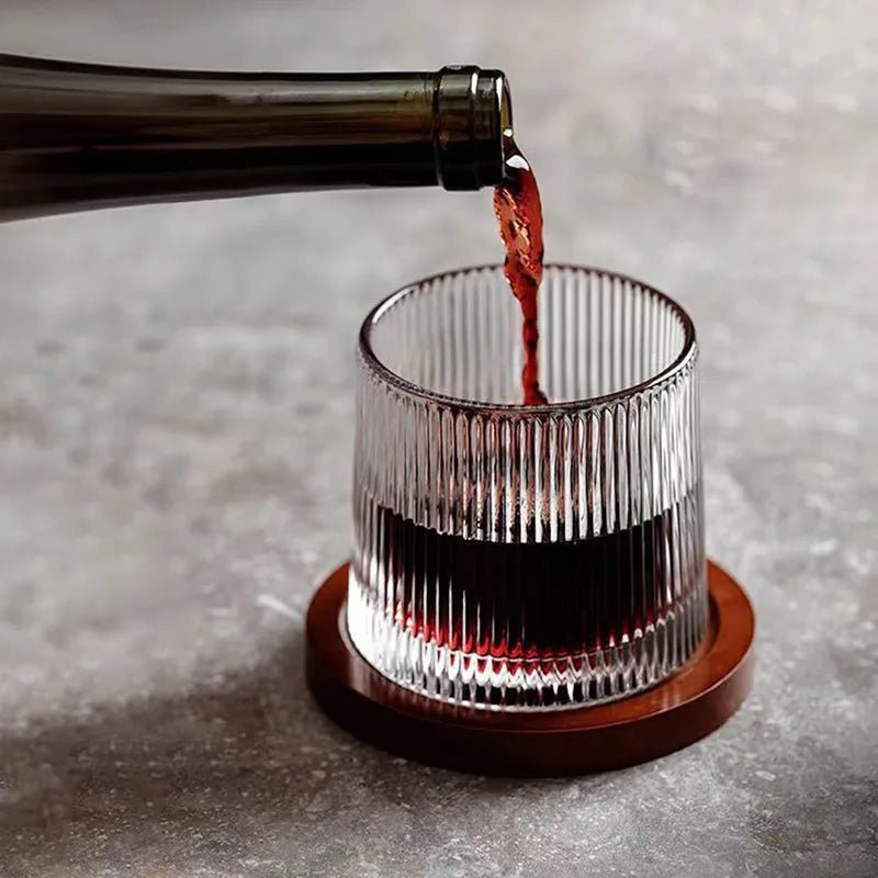 Whirluxe roterbare whiskyglass — bred, rund spinnbase