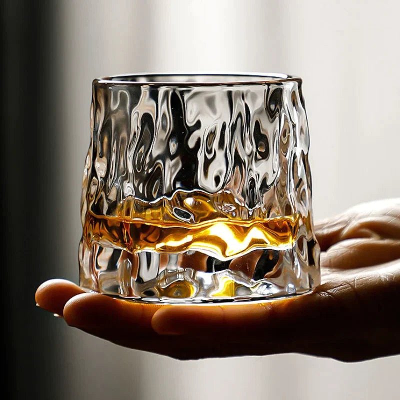 Whirluxe roterbare whiskyglass — bred, rund spinnbase