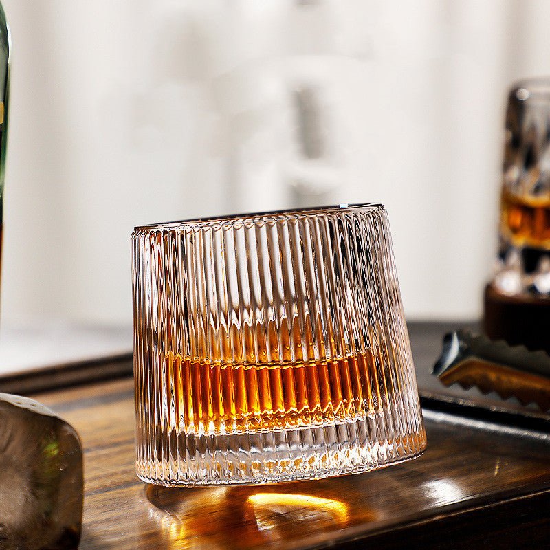 Whirluxe roterbare whiskyglass — bred, rund spinnbase