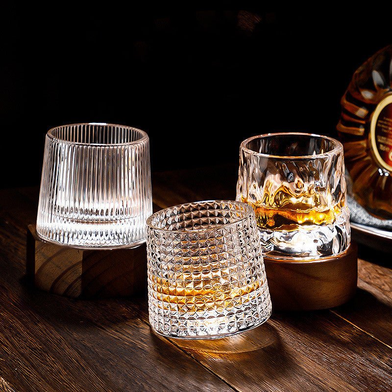 Whirluxe roterbare whiskyglass — bred, rund spinnbase