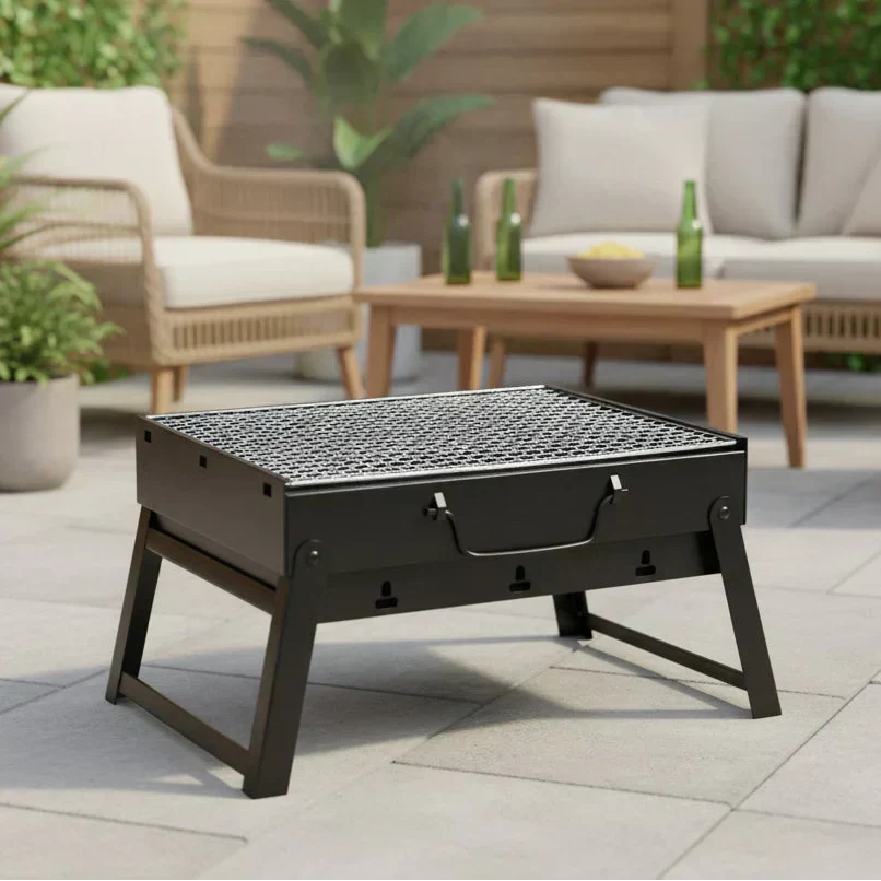 TrailBlaze-kulgrill i rustfrit stål — kompakt sammenklappeligt design