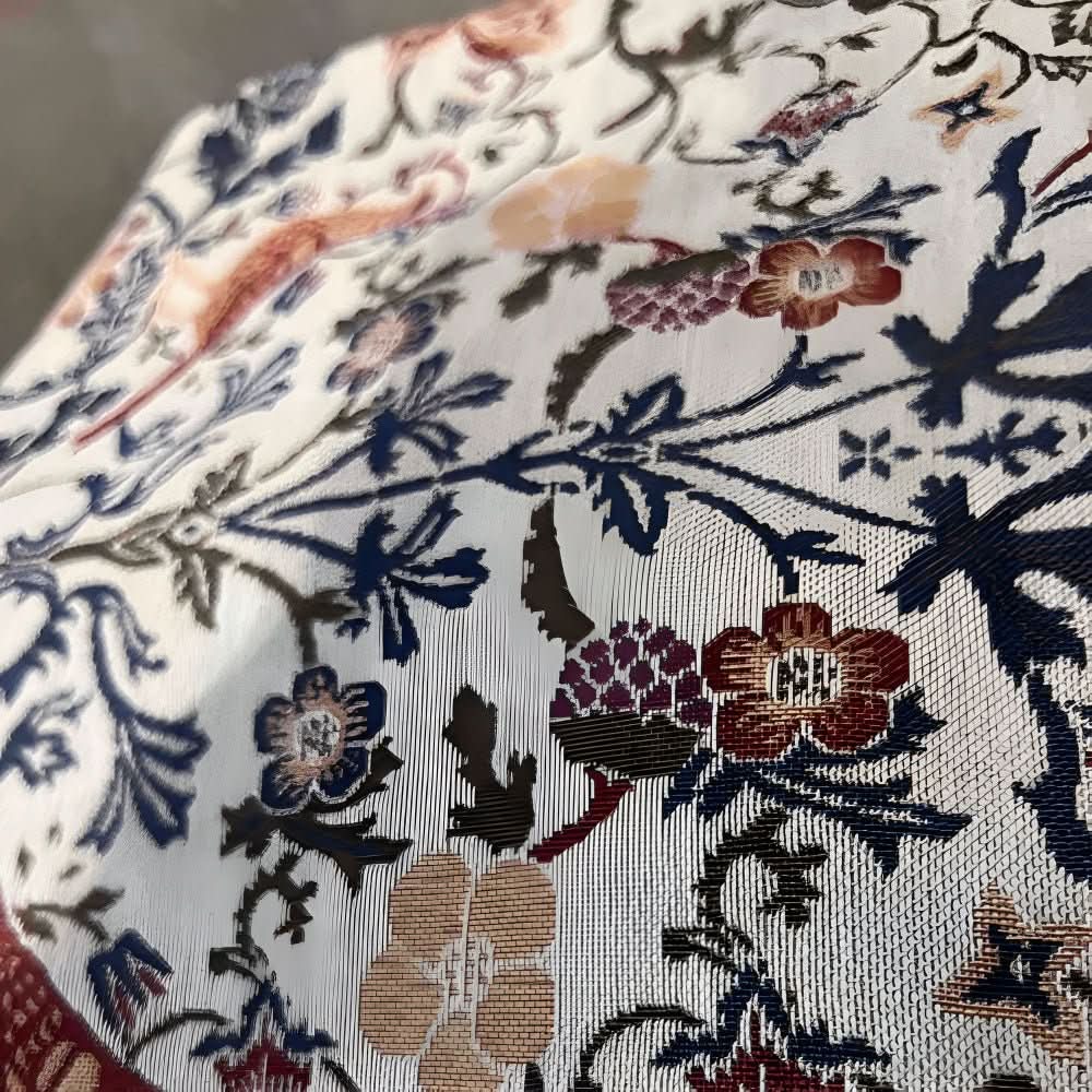 Caminho de mesa Heritage Looms com elegante motivo floral e de pássaros