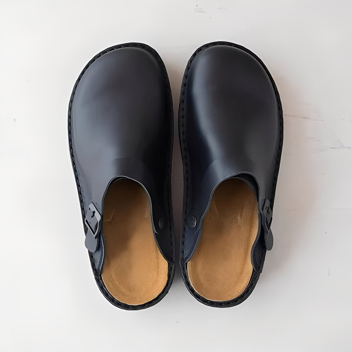 Læderhjemmesko til mænd — slip-on-design med komfortsål