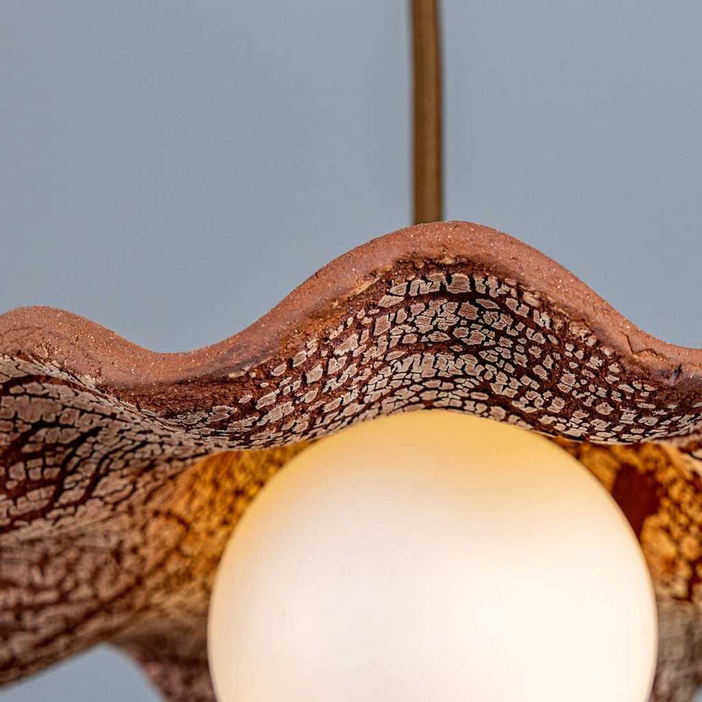 Lyrea Red Iron Wavy Ceramic Pendant Light Opal Glass Globe