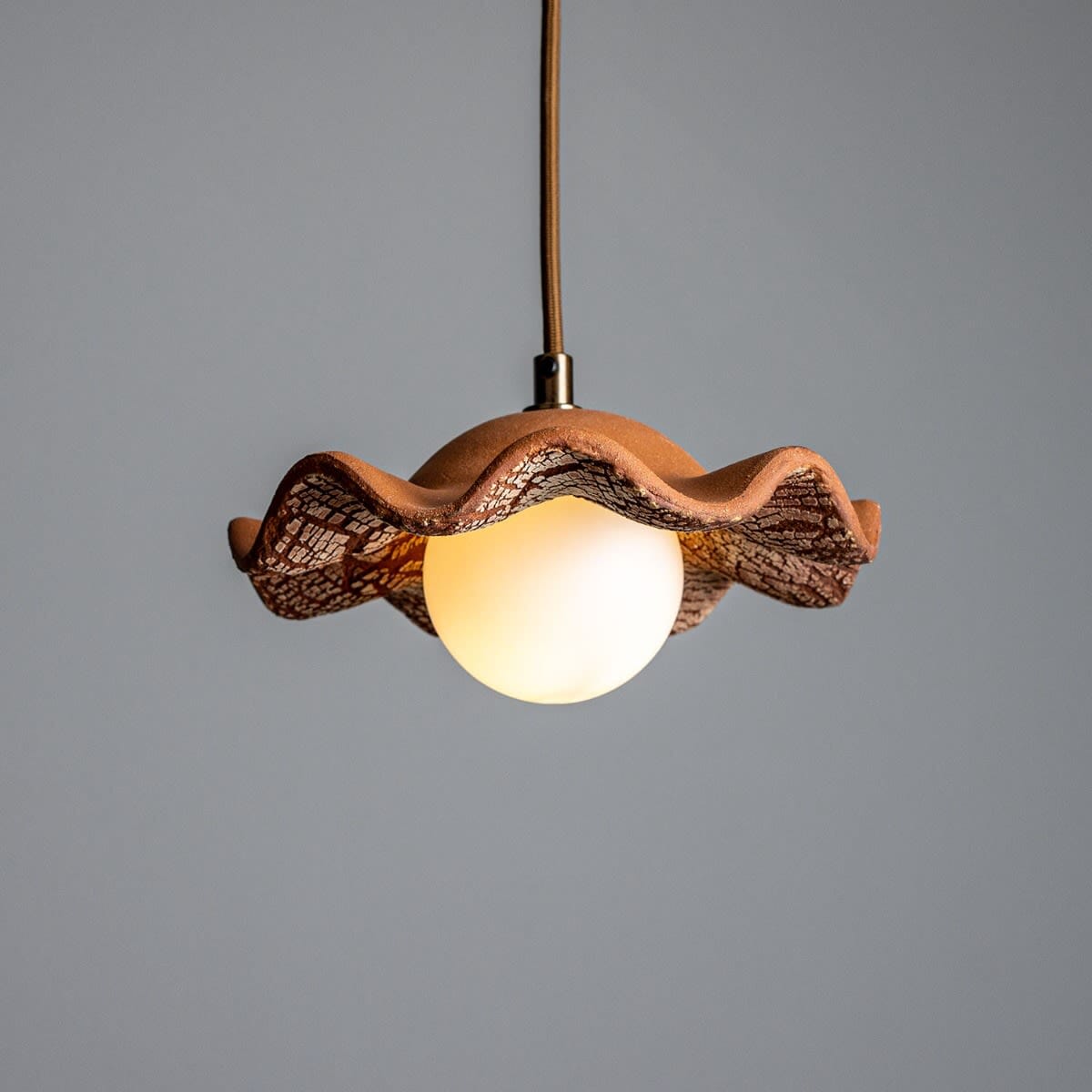 Lyrea Red Iron Wavy Ceramic Pendant Light Opal Glass Globe